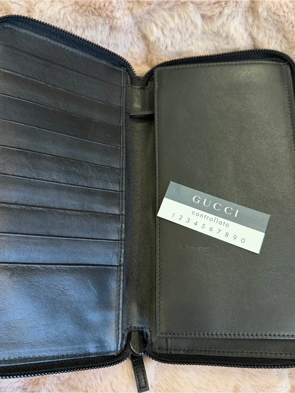 Gucci Black Leather Wallet with Embossed Logo